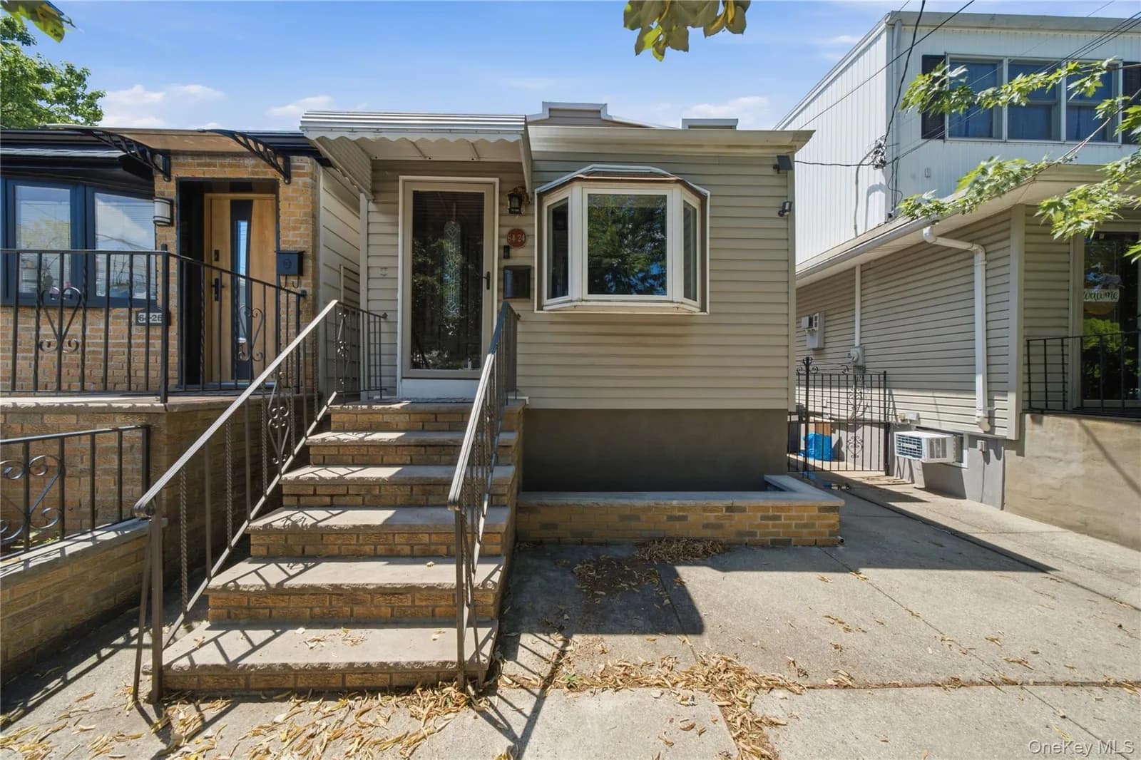 Single Family Residence in Middle Village, NY